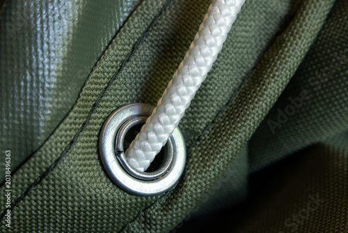 фотографія Macro shot showing green heavy duty canvas tarpaulin fabric texture details meta
