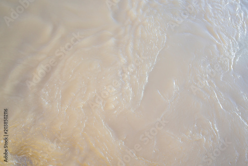 Close up of water in the river. Water surface texture background.