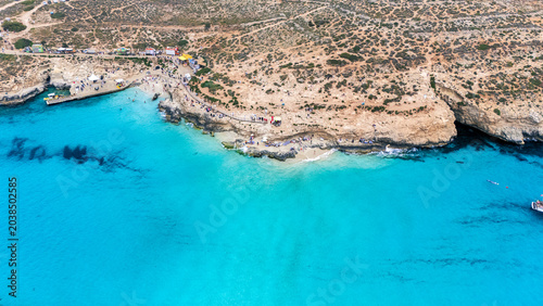 Tableau sur toile Landscape aerial drone shot of the blue lagoon beach and port in malta, comino i