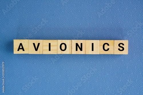 фотографія Wooden cube with the word avionics