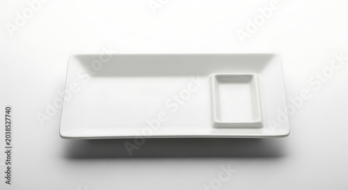 Modern white rectangular ceramic serving dish with integrated sauce bowl, isolated on clean background