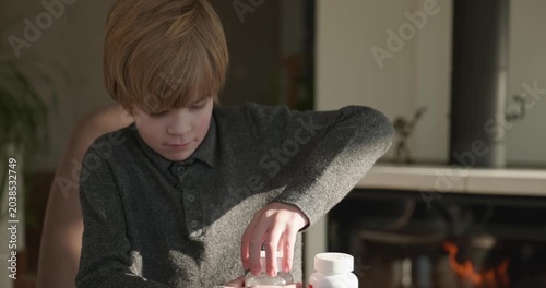 Kid Boy Takes Vitamin Pills. 4K 10-bit
