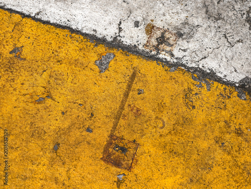 yellow paint on concrete surface
