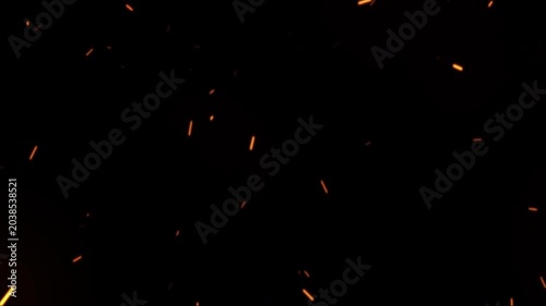Hot Burning Sparks and Embers Flying Upwards on a Black Background.