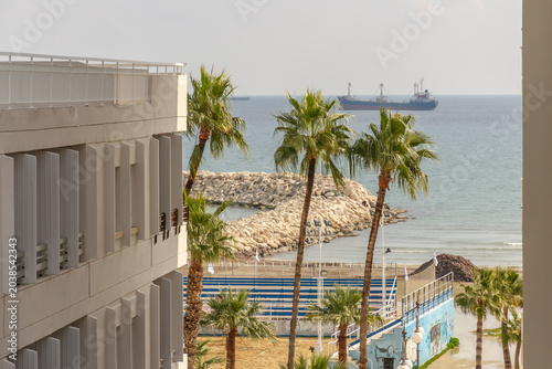 Foto Cityscape view of Phinikoudes beach from hotel window in late winter