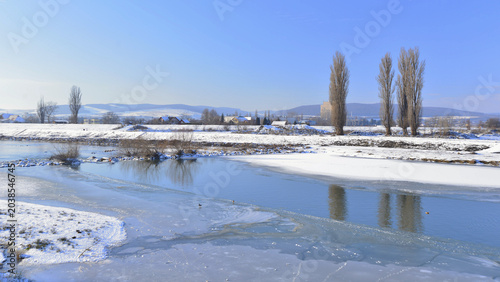 Quadro su tela A clear but bitterly cold winter's day in Transylvania, on the banks of the River Mures