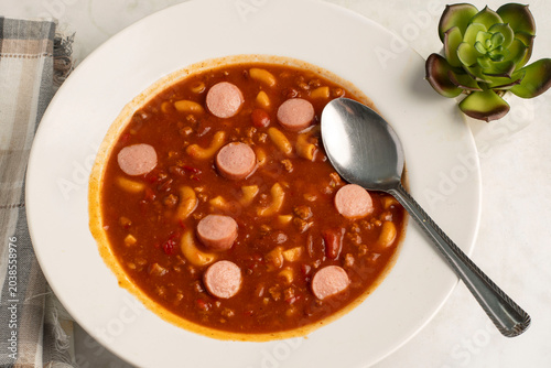 chili macaroni   served with  sliced hot dogs