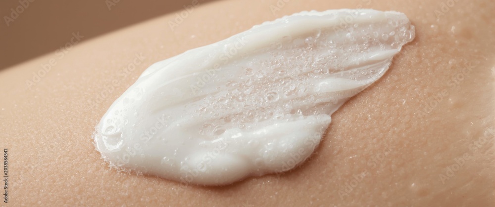 Obraz premium Detailed shot of smooth facial foam lather on skin