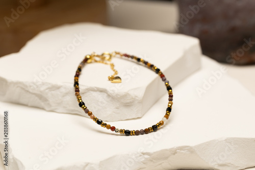 Handmade beaded bracelet featuring mookaite jasper beads and gold spacer beads. Fashion jewelry accessory for jewelry making and DIY crafts.