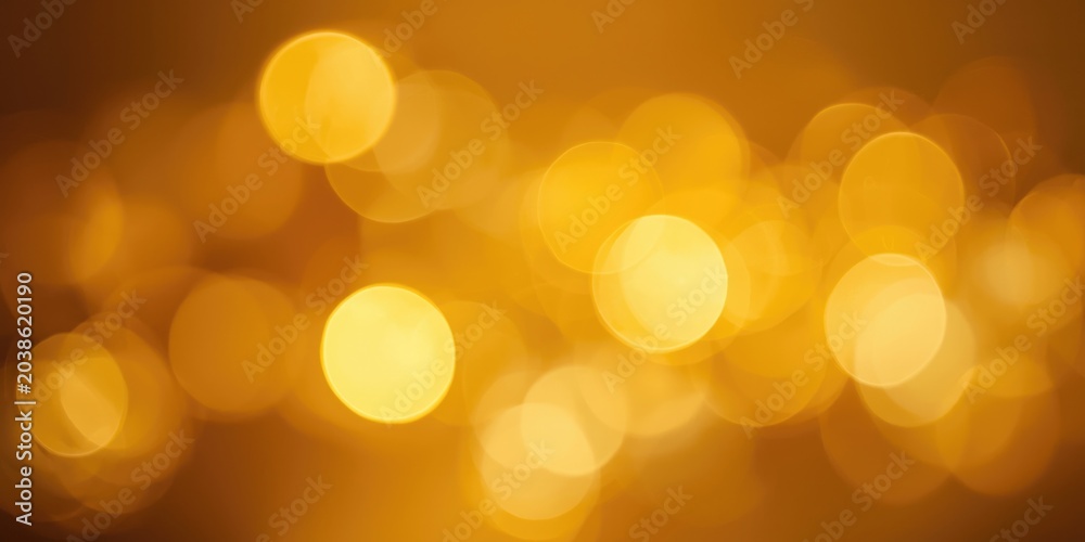 Fototapeta premium Golden warm bokeh bubbles in soft focus for creative abstract background scenes