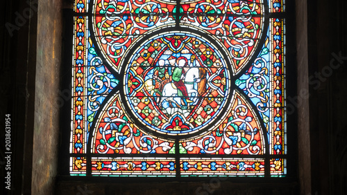 Εκτύπωση καμβά Round medieval stained glass rose window with horseman figure at cathedral inter