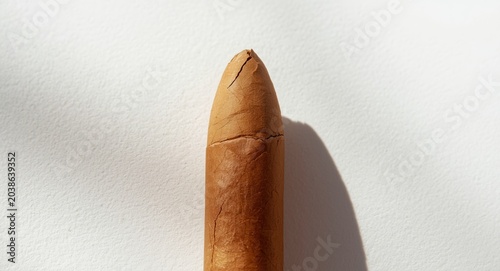 Close up of premium cigar on plain white background with top view