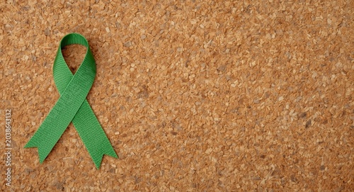Green ribbon pinned on cork...