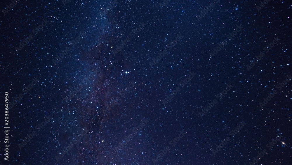 Fototapeta premium Dynamic colorful star loaded night sky astronomical background