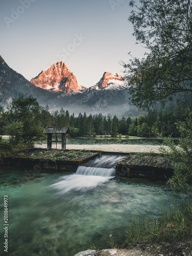 Schiederweiher lake with wooden footbridge and mountain scenery in Upper Austria