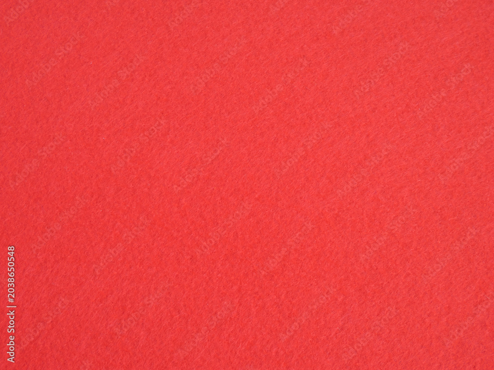 Fototapeta premium Red felt fabric texture background with soft synthetic fibers close up