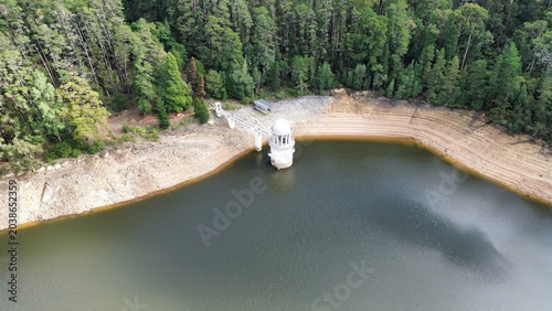 Bild auf Leinwand Reservoir intake tower showing low water level and drought