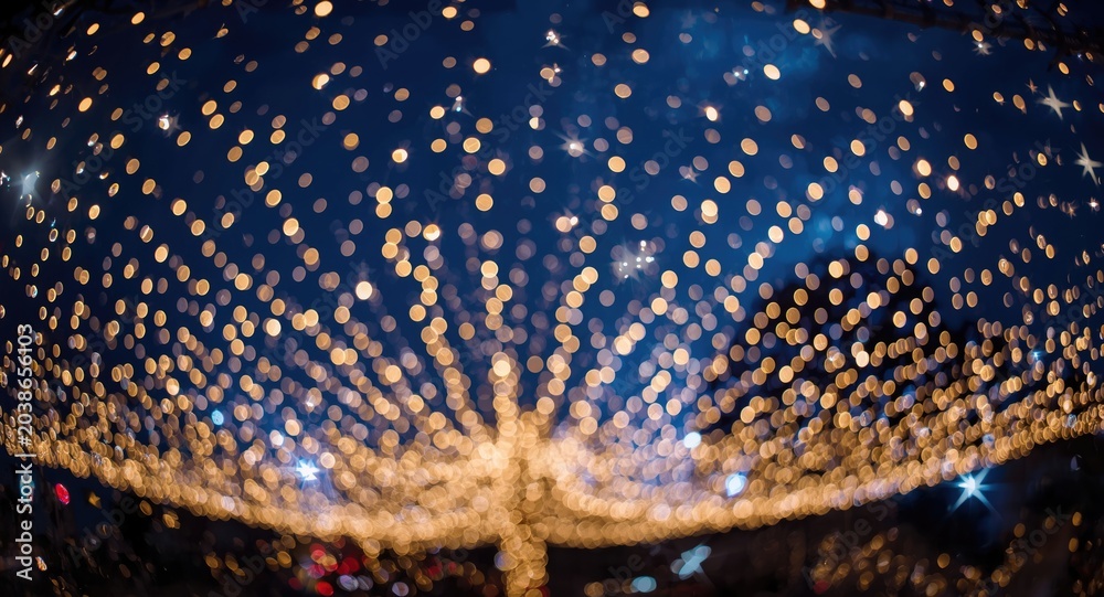 Obraz premium Festive Christmas background featuring twinkling lights and bright stars