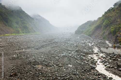 Photos Misty Riverbed Scarred by Flood Damage