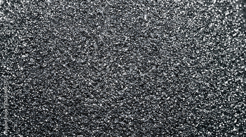 Elegant Black Glitter Texture Background with Shimmering Silver Sparkles and Grainy Surface for Luxury Branding and Festive Design Backdrop