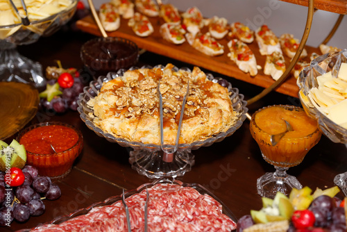 Golden baked brie pastry tart topped with crunchy walnuts and caramel sauce