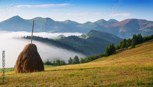 Amazing Mountain Landscape With Fog And A Haystack