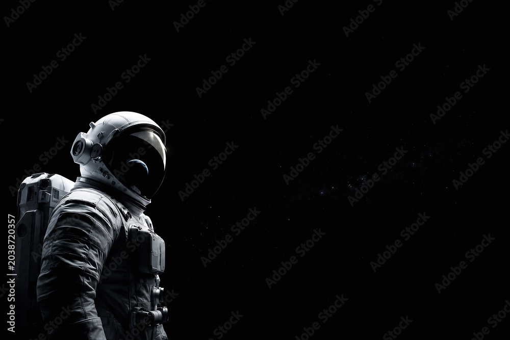 Obraz premium An astronaut in a spacesuit is shown against the blackness of space.