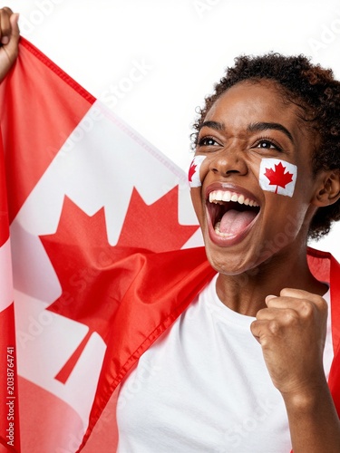 Excited Canadian sports fan cheering with national flag
