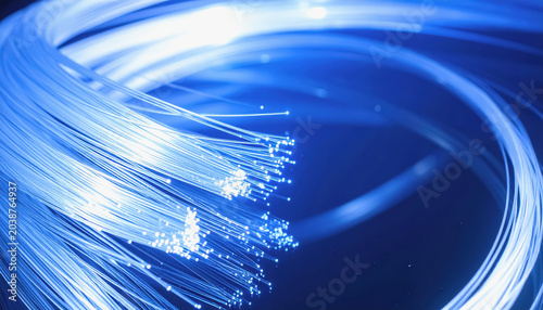 Close-up of bright blue fiber optic bundle with illuminated tips