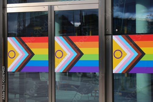 Photography LGBTQ rainbow flag in a company office door for the Pride Month (June) in Dublin, Ireland