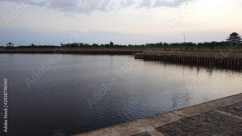 murky, flowing irrigation river water, landscape dam water 