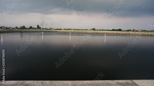 murky, flowing irrigation river water, landscape dam water 