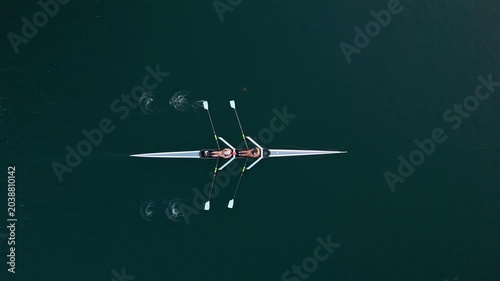 Glimpse the power of young women athletes as they expertly navigate a two-seater rowing boat. Their synchronized strokes create ripples in the serene waters of Halifax Ocean Bay