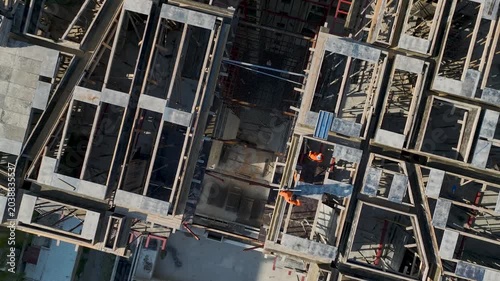 Aerial Video of Rooftop Construction Activity with Ocean View