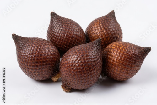 fresh organic snake fruits or salak isolated on a white background creates a healthy raw fruit