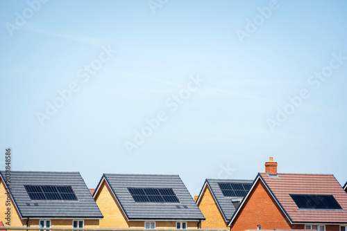Photovoltaic solar panels on the roof of new built house in england uk. The concept of a sustainable environment, construction.