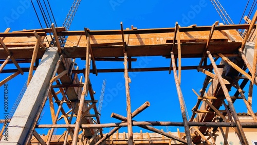 Wooden Construction Framework, Rustic Building Structure Under Blue Sky