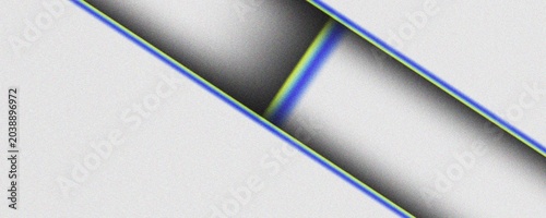 Billede på lærred A closeup view of intersecting blue and yellow lines on a gray textured surface