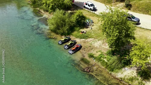 Aerial Video of Jet Skis Riding Scenic River With Green Surroundings
