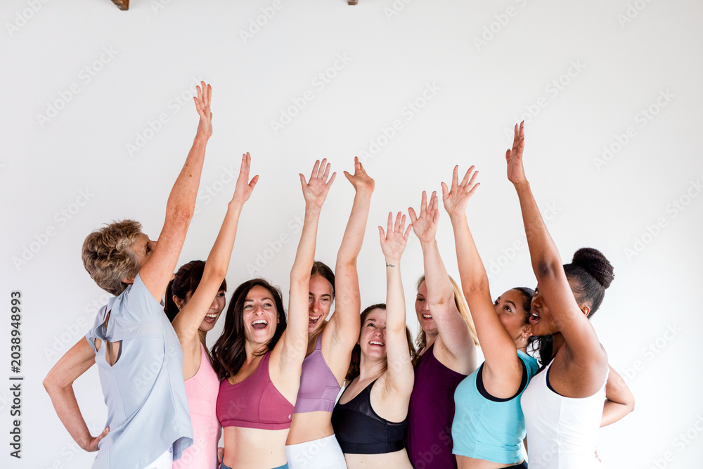 Fototapeta premium Group celebrating joyful fitness unity.