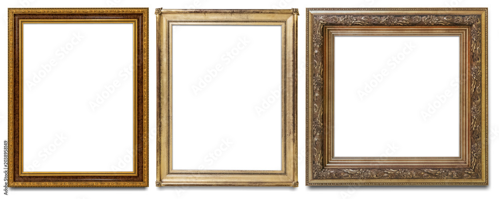 Fototapeta premium Three ornate, empty picture frames in gold and bronze tones.