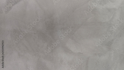 A textured grey concrete surface background.