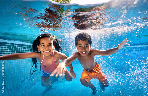 happy kids having fun in the pool