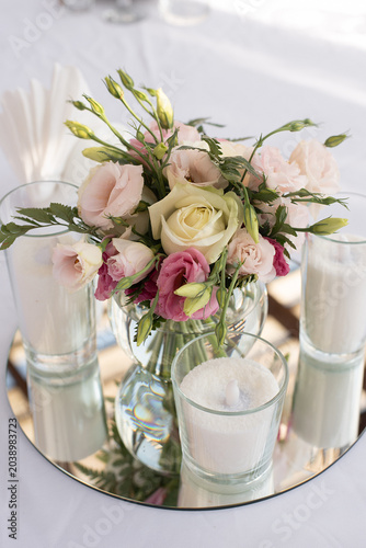 Beautiful wedding table that decorated with flower arrangements and candles