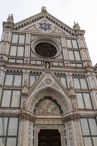 Detailed view of the ornate facade of the Basilica di Santa Croce, a masterpiece of Gothic and Renaissance design in Florence, Italy