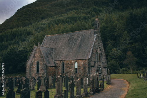 Tableau sur toile Historic stone Gothic church in the dramatic valley of Glen Coe, Scottish Highla
