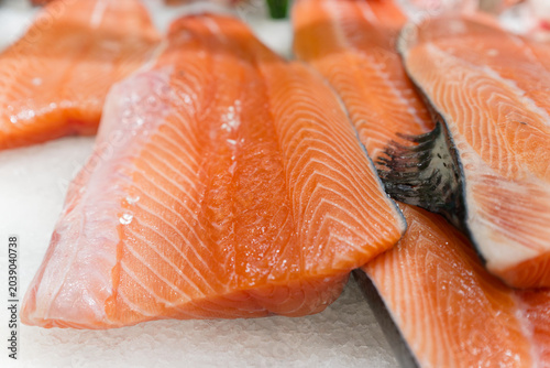 Salmon fillets showcasing nutritious pink flesh on a bed of crushed ice