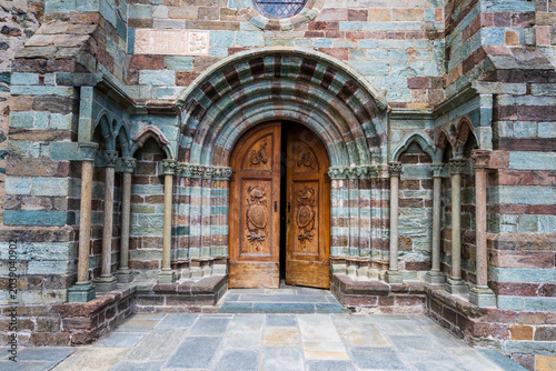 Finely carved wooden entrance door of the abbey church of the Sacra di San Michele
