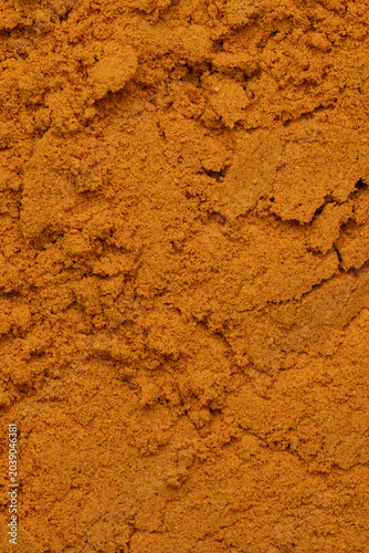 Ground curry spice texture background macro full