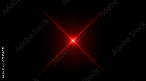 Foto red light flare with cross shape on black background